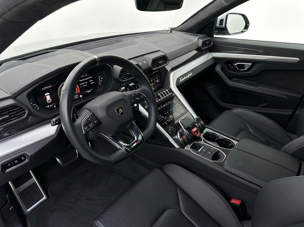Phone snap of a car interior next to its showroom render — after